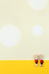 Abstract background with colorful wooden pins and paper