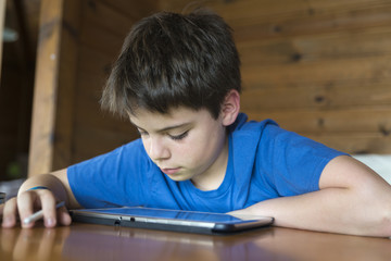 Young boy and a tablet digital