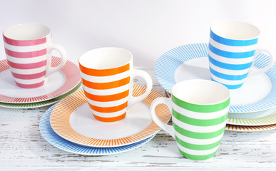 Different tableware on shelf, isolated on white