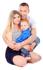 Happy young couple with small baby isolated on white