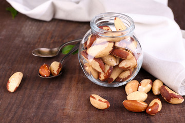 Tasty brasil nuts on wooden background