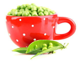 Fresh green peas in mug isolated on white background