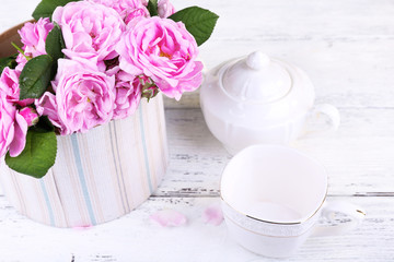 Breakfast tea with  teapot of fresh pink garden roses
