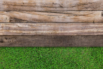 Brown wood texture on grass