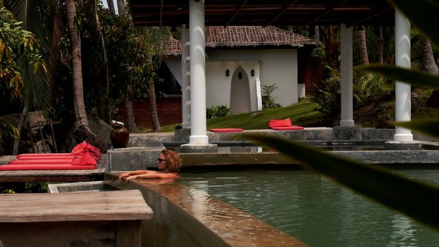 Woman Relaxing in Pool in Sea View Resort. Thailand. Koh Samui.