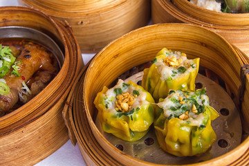 Chinese dimsum bamboo steamer isolated on white background
