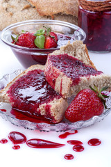Homemade organic strawberry jam on wholemeal bread