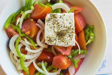 fresh tasty greek salad served on a plate