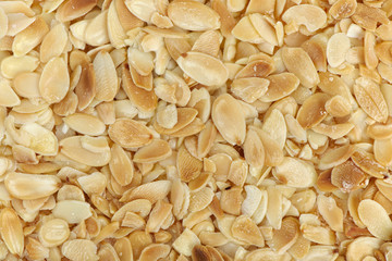 Sliced almonds background. Top view.