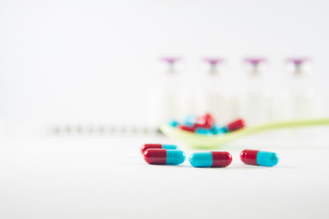 Red and Grey capsule show medicine concept