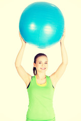 Woman with pilates exercise ball.