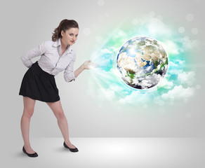 Young woman with earth and cloud concept