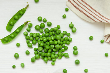 Close-up of green peas on wooden background