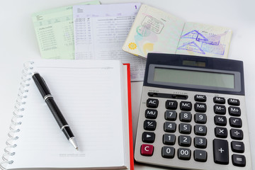 Bank account book ,passport and calculator