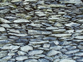 Texture of old stony wall from nature marlite material, broken