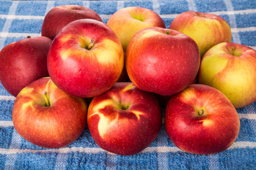 Red and Green Apples on Blue Towel