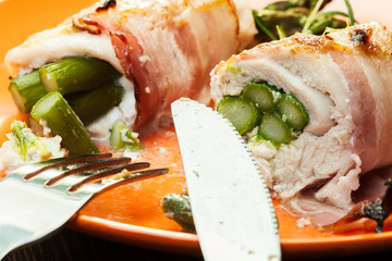 Baked asparagus wrapped in chicken and bacon