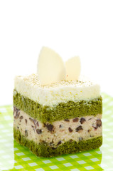 Matcha green tea cake isolated on white background