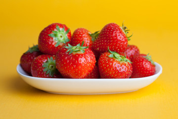 Strawberries berrys  on yellow background