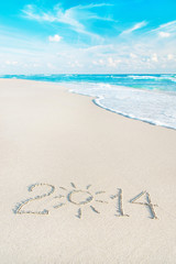 Happy New Year 2014 season concept on sea beach