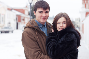 Young happy couple in winter city