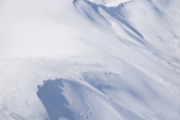 Fototapeta na wymiar WInter snowy mountains landscape with blue sky