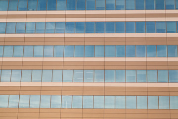 Horizontal row of office building windows in frames