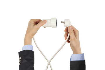 Businesswoman holding power cord and plug