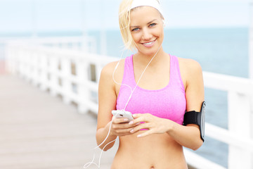 Sports woman with phone