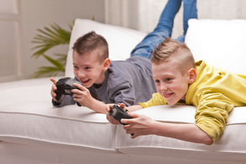 two kids playing video games
