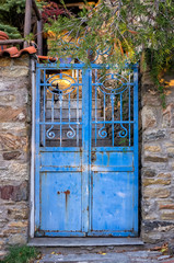 Old blue metallic gate in Parthenonas village, Greece
