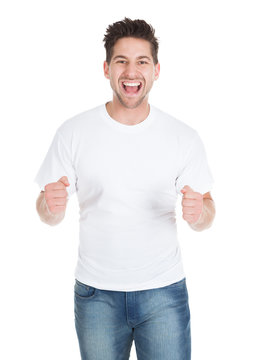 Excited Young Man With Clenching Fists