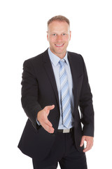 Confident Businessman Offering Handshake