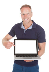 Man Pointing At Laptop Screen