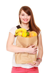 Grocery. Girl holding paper shopping bag with fruits