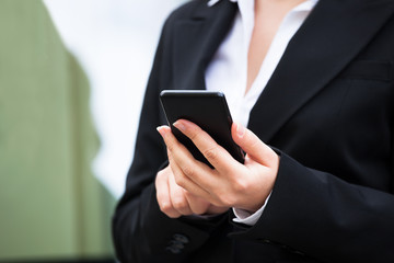 Businesswoman Using Smartphone Outdoors