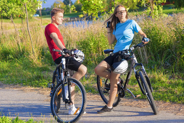 Fototapeta na wymiar Two Young Caucasian Bikers Resting Outdoors