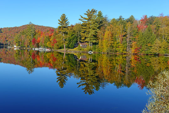 Autumn colors reflected in quiet lake