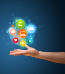 Multimedia icons in the hand of a woman