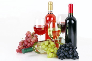 Obraz premium Bottiglie di vino con uva