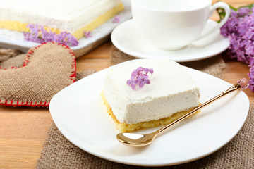 Delicious dessert with lilac flowers
