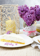 Delicious dessert with lilac flowers