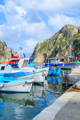 Fototapeta na wymiar Fishing boats in a port in Greece