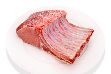 Raw pork on white plate isolated on white background.