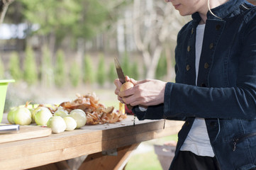 Woman peeling onions