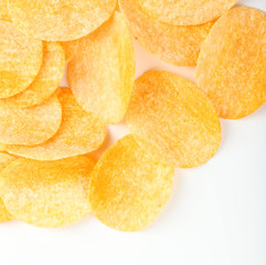 Homemade potato chips isolated on white