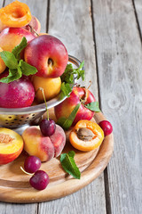 Apricots, nectarines and saturn peaches background