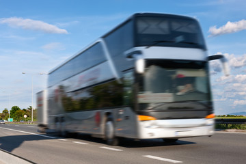 White bus in motion blur on the highway