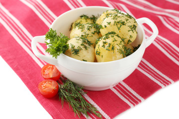 Young boiled potatoes in bowl, close up