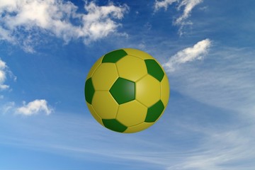 Fototapeta na wymiar soccer ball in brazilian colors, on a blue sky background